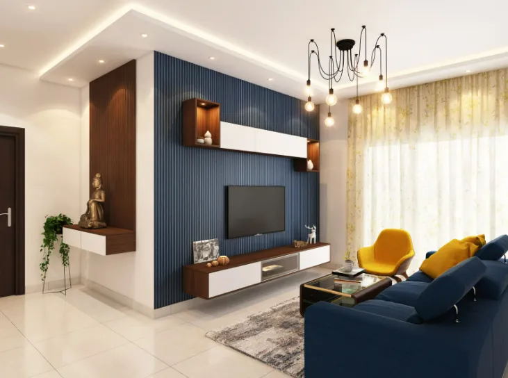 Modern living room with blue accent wall, TV unit, yellow armchair, and cozy lighting showcasing drywall repair.