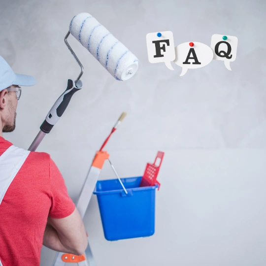 Painting service FAQ concept with painter holding roller, ladder, and paint bucket against clean wall background