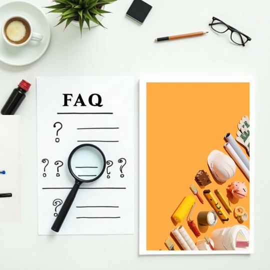 FAQ concept with magnifying glass over question marks and home improvement tools on desk for remodeling service help section